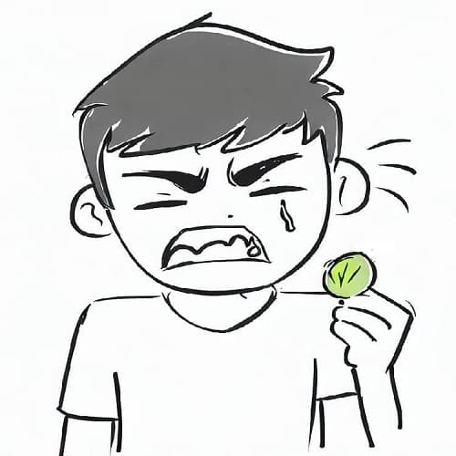 Boy making a terrible face when eating a fruit Boy making a terrible face when eating a fruit