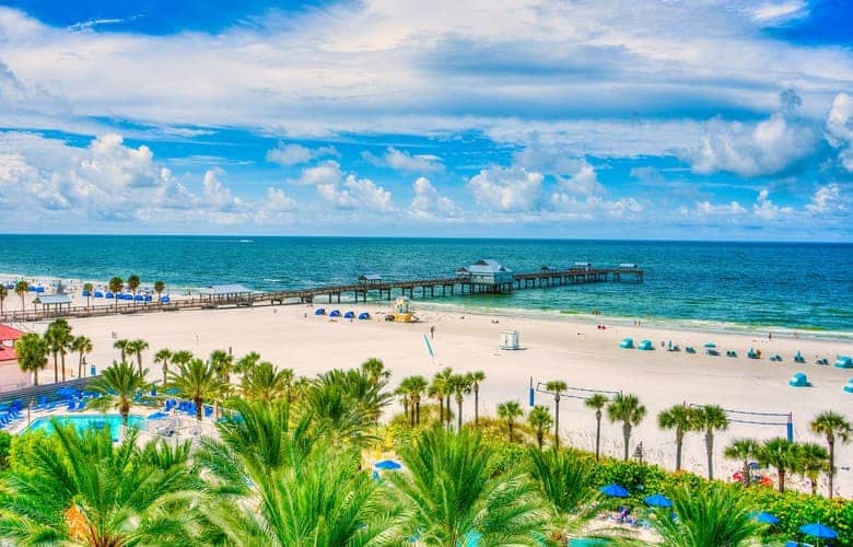 Clearwater Beach with palm tree borders, soft sand, and a pier Clearwater Beach with palm tree borders, soft sand, and a pier