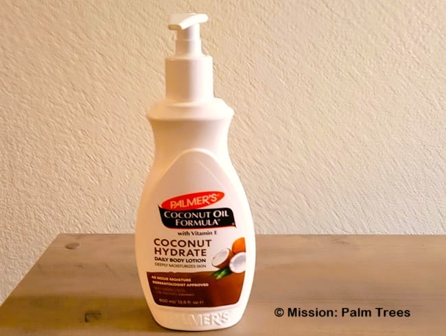 A pump bottle of coconut body lotion on top of a table