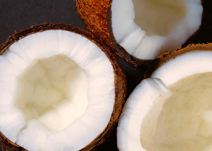 Halved coconuts showing their edible meat