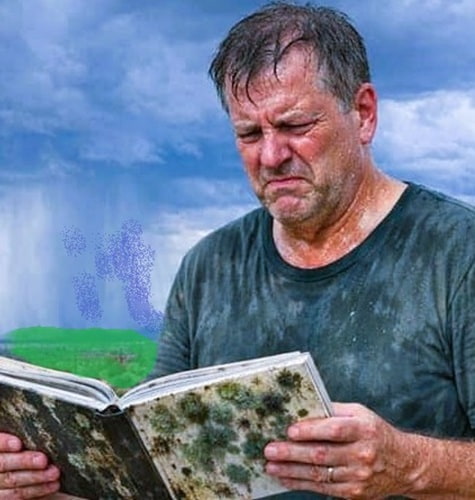man reading a book while stormy weather is creating uncomforable humidity