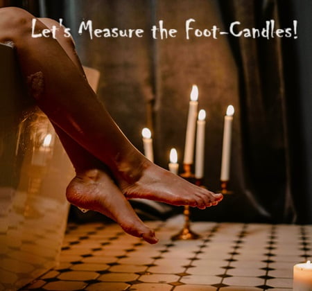 amusing in that there are candles by a woman's feet. Can foot candles be measured?
