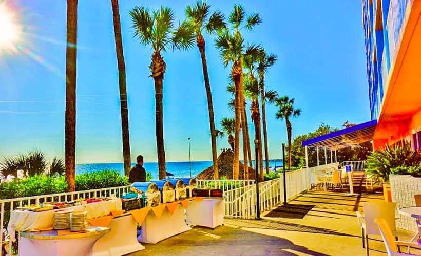 Walkway leading to beach with palms in Florida