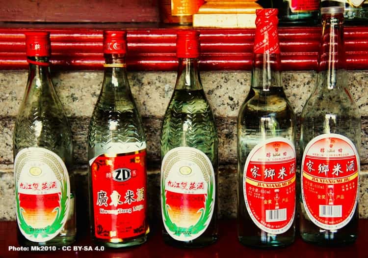 Assorted bottles of rice win on a counter