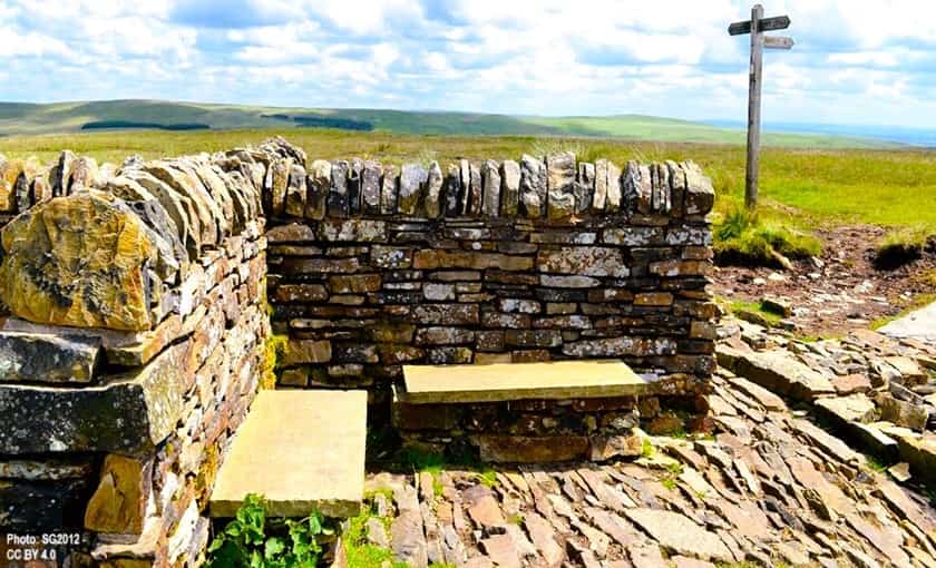 A stone wall used as a windbreak for seating