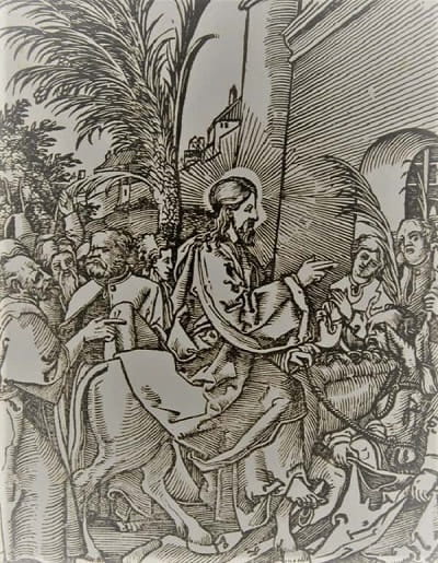 People surrounding Jesus as he enters Jerusalem