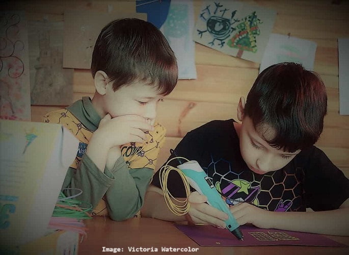 two boys working on crafts